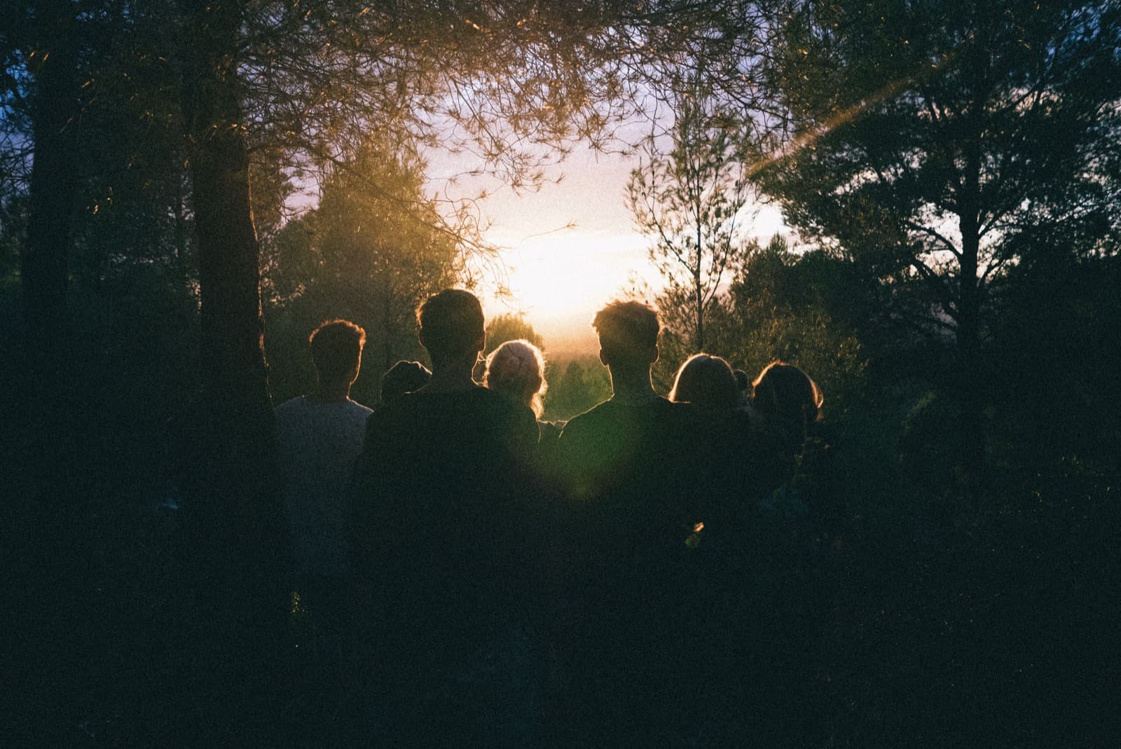 Friends pausing together on a mountain trail