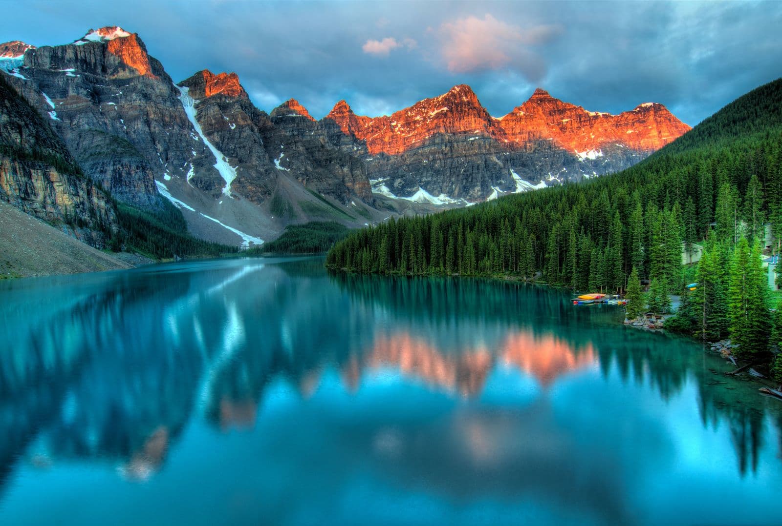 Mountain peaks reflected in a still alpine lake